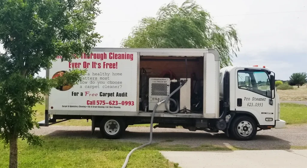 A truck is parked on the side of the road.