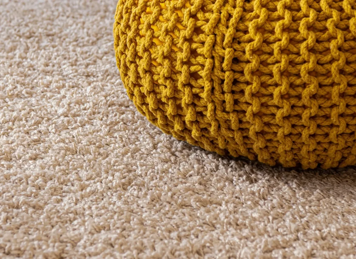 A close up of the carpet on the floor
