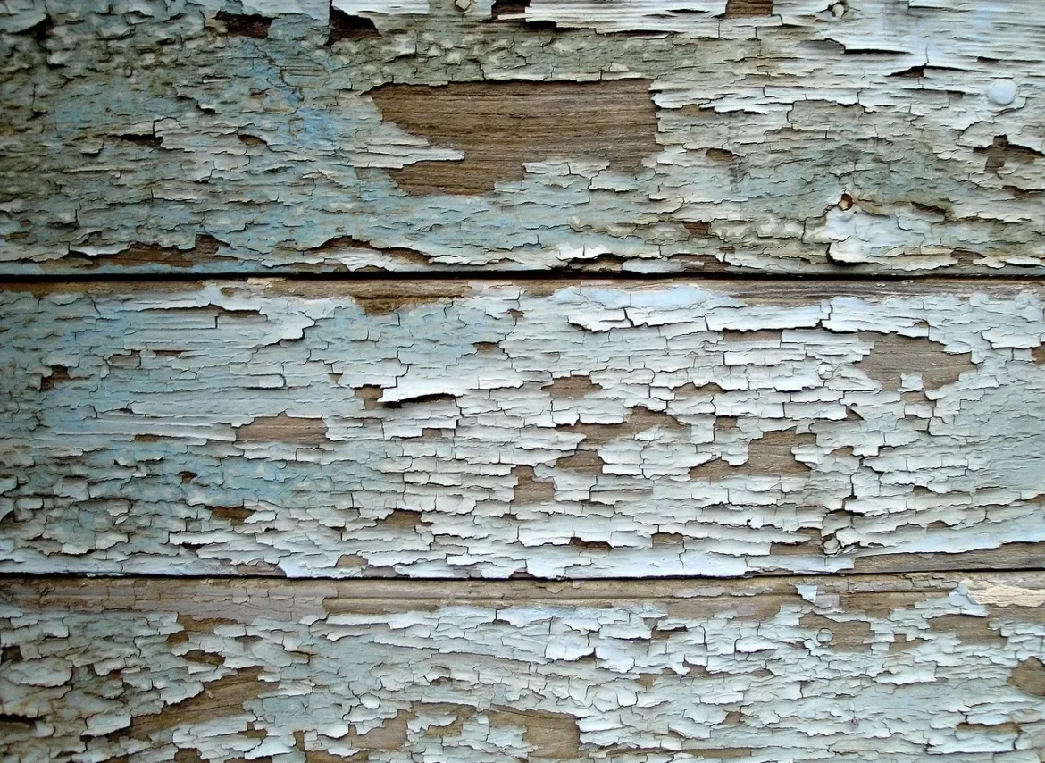 A close up of the wood paneling that is peeling.